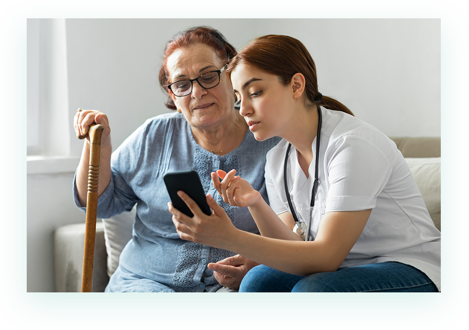 Nurse helping patient use SimpliHere app to communicate