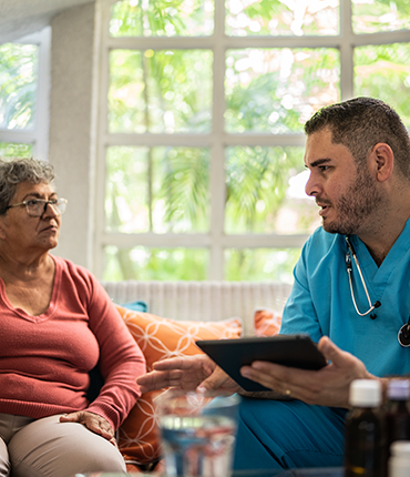 male nurse with patient using SimpliHere on an iPad